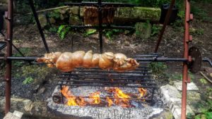 Slow roast suckling pig - porchetta style herb stuffed